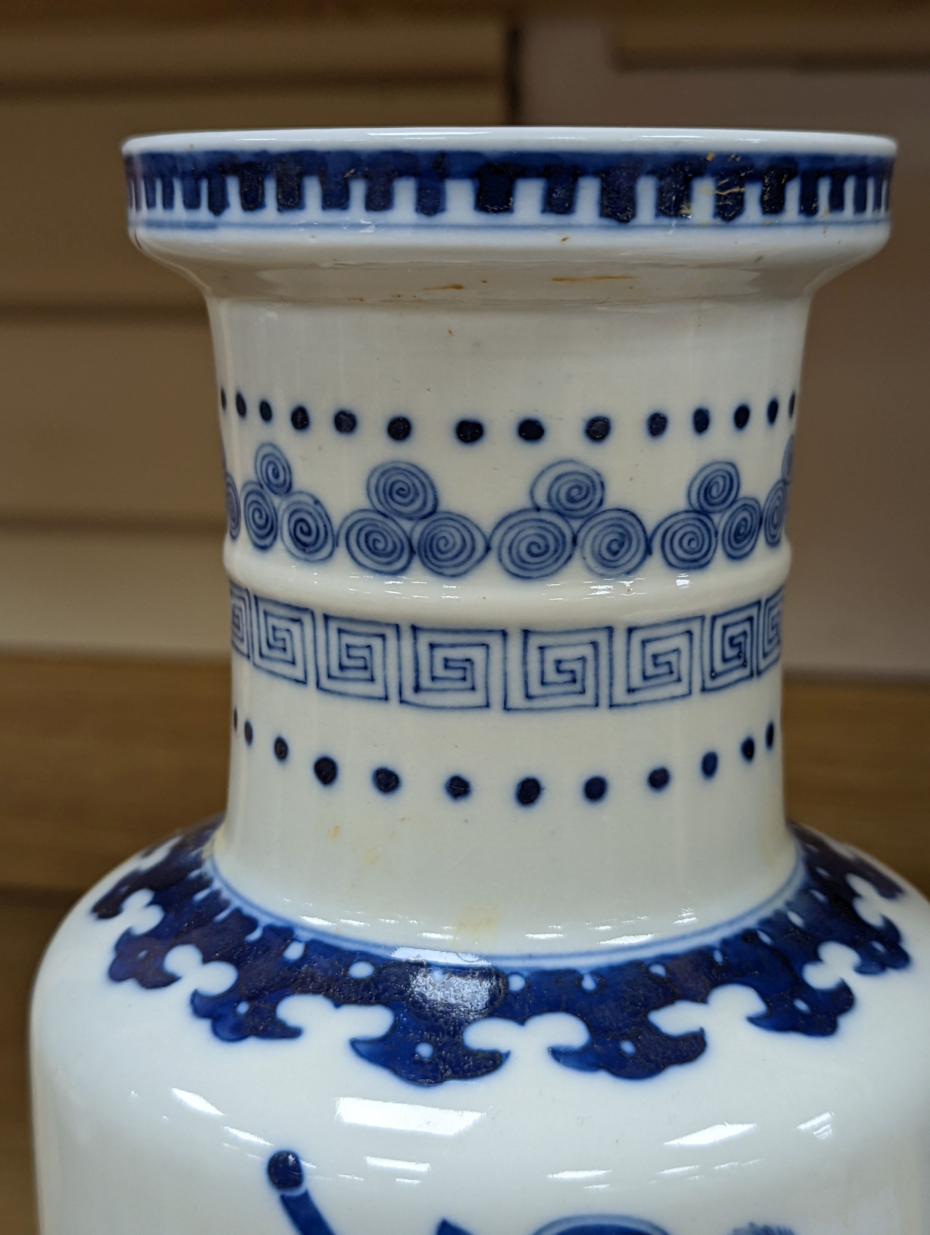 A Chinese blue and white rouleau vase, 35 cms.